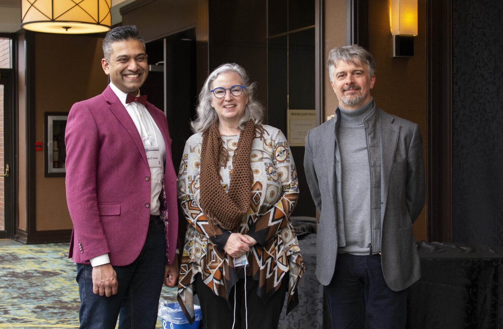 Rohan D'Souza stands next to Lisa Schwartz and Alfonso Iorio. 