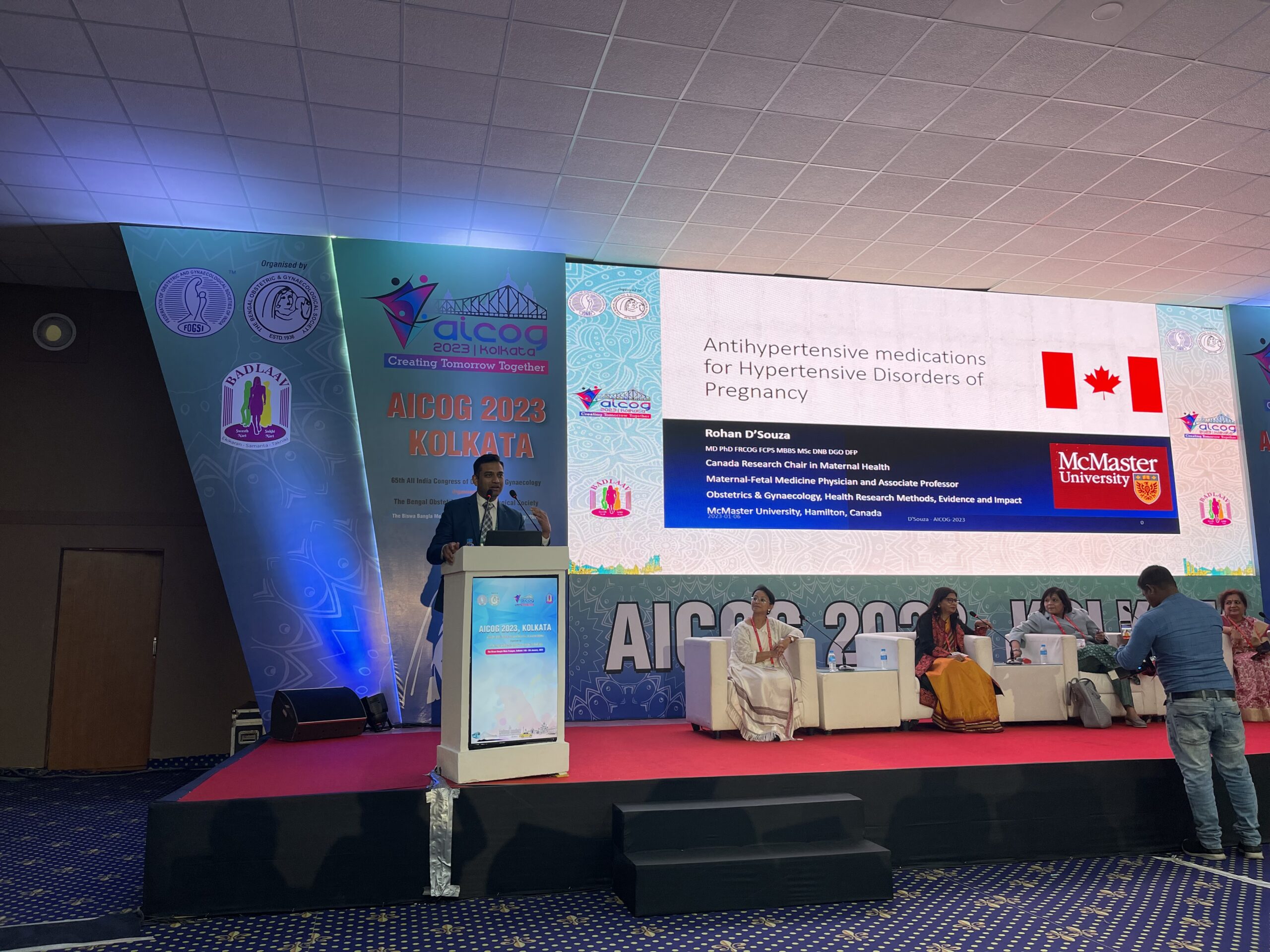 Rohan D'Souza standing behind a podium.