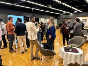 Members of FLOURISH lab conversing with other researchers at the speed networking event